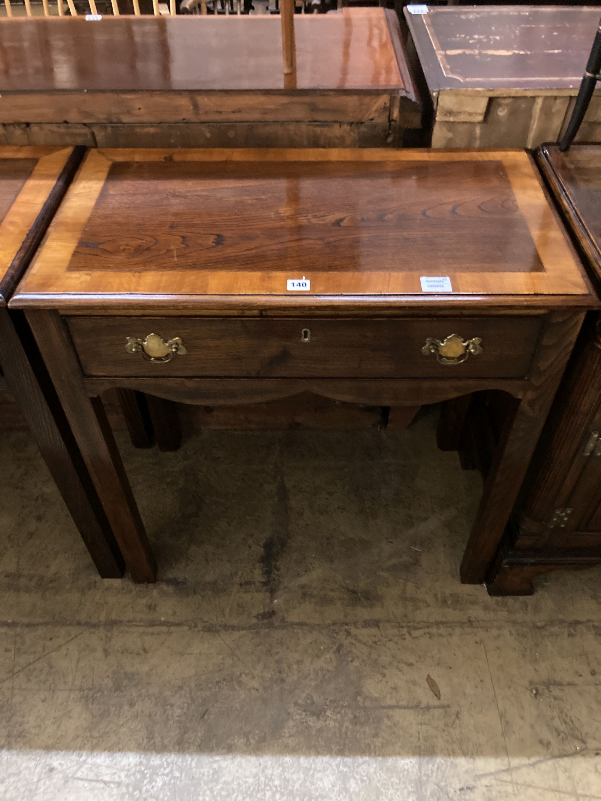 A pair of George III style cross banded oak side tables, width 80cm, depth 45cm, height 82cm